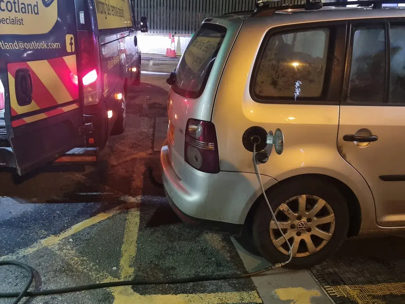 Fuel Drain Scotland roadside support van assisting a vehicle at night.