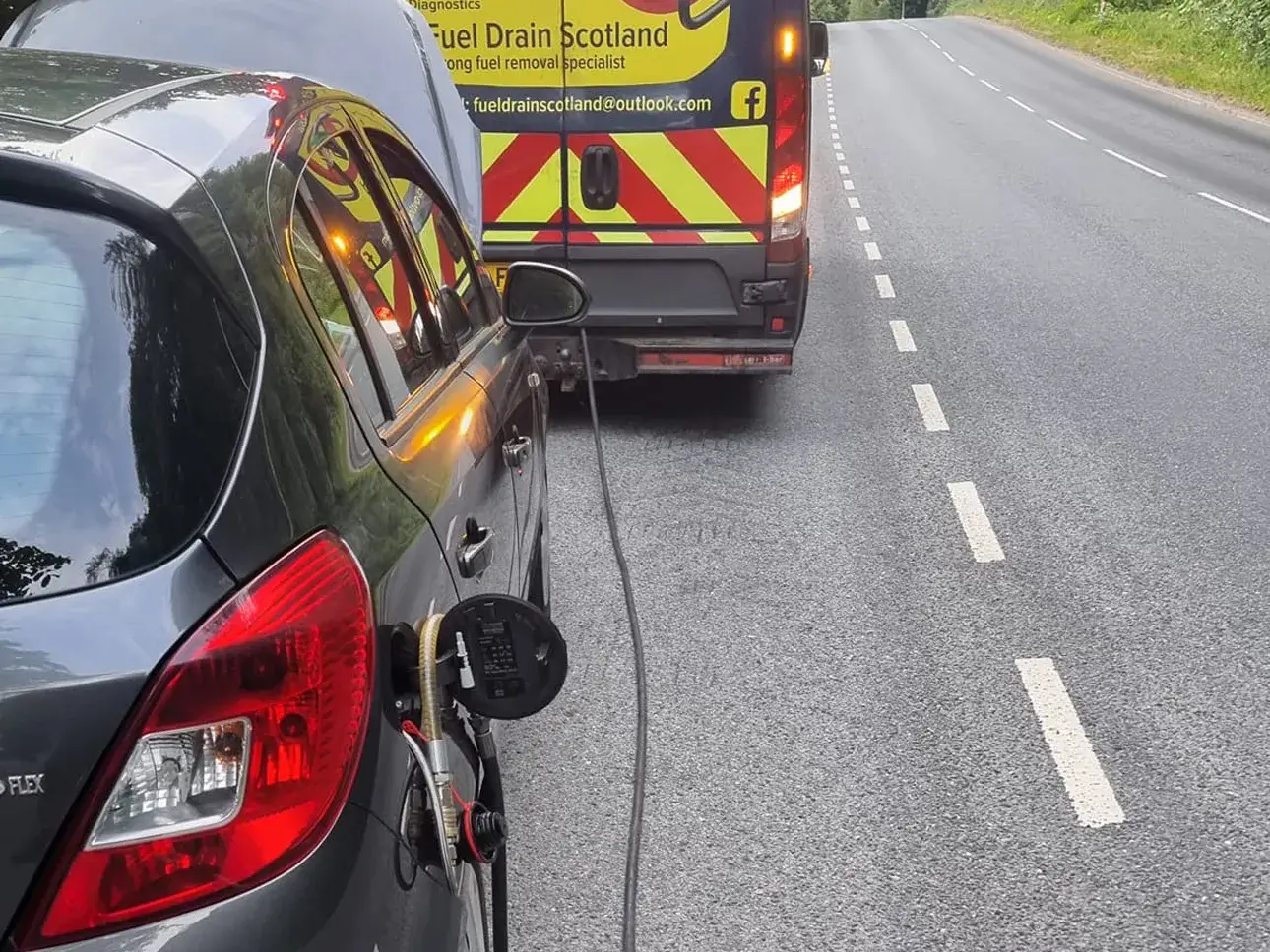 A Fuel Drain Scotland van carrying out a roadside fuel drain.